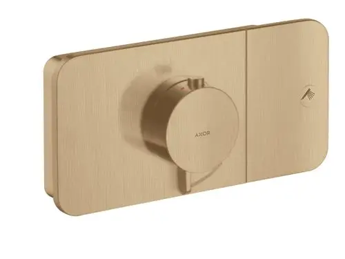 Thermostatmodul in brushed bronze von AXOR, mit einem runden Drehregler zur Steuerung, montiert auf einer rechteckigen Grundfläche.